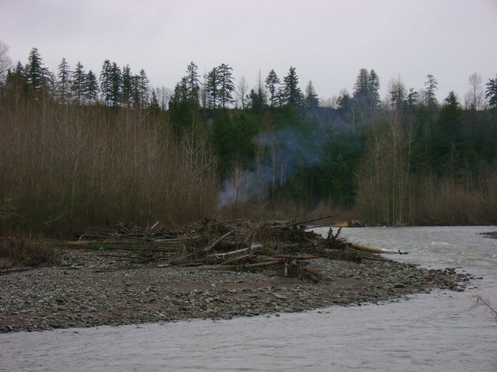 Hunters' campfire across the river