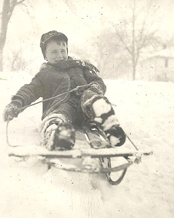 Pete heads his sled down Oak Street.