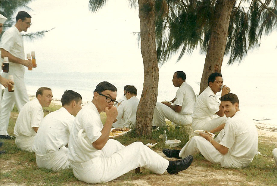 Eating and relaxing under the trees by the sea.